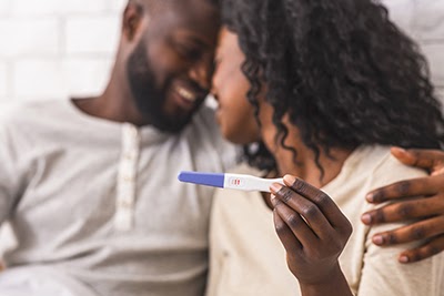 Loving couple thrilled by positive pregnancy test
